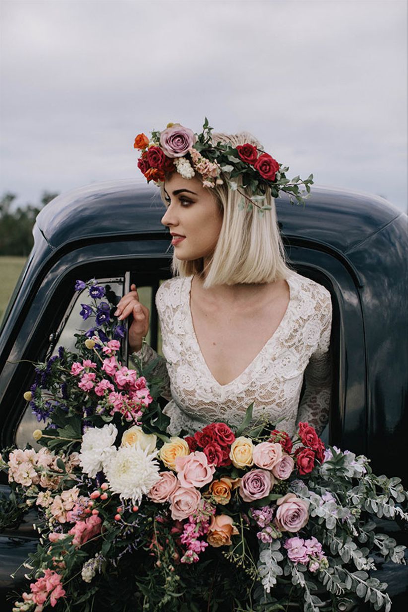 bride wearing colorful flower crown