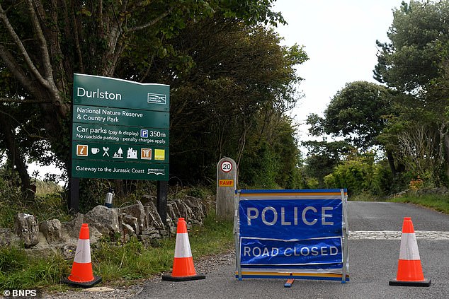 The coroner has been informed of the deaths and police are now working to identify them (the park has been closed off by police, pictured)