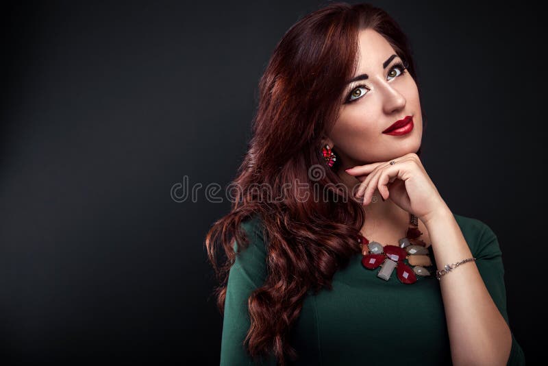 Beautiful woman with perfect make-up and manicure wearing jewellery stock photography