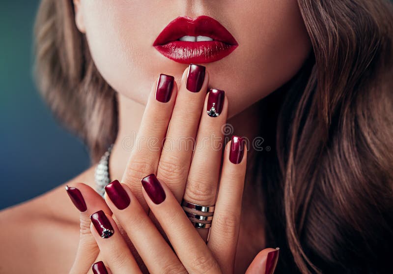 Beautiful woman with red lips and manicure stock photo