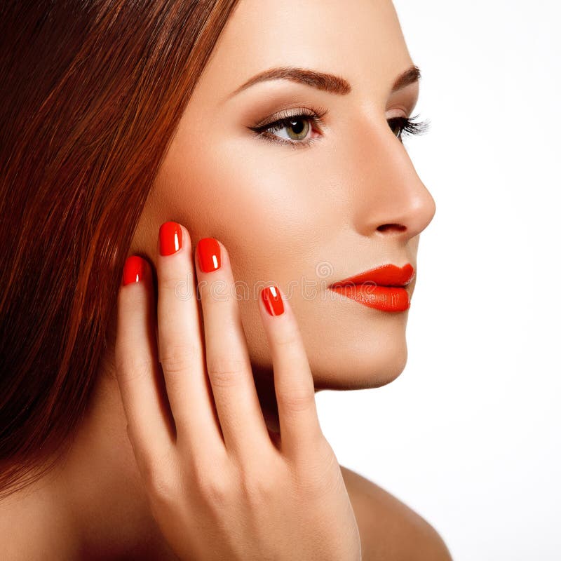 Beautiful Woman With Red Nails. Makeup and Manicure. Red Lips stock photography