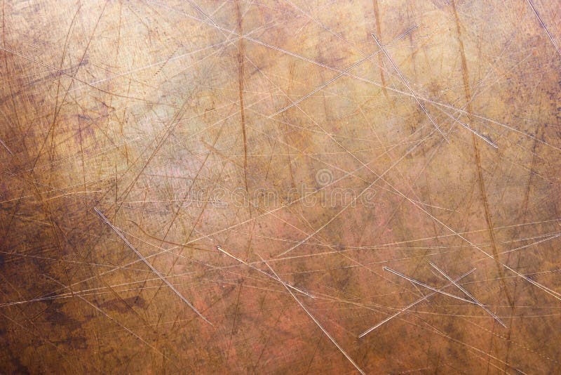 Brushed surface of brass, old plate of copper texture. Worn sheet copper, metal texture close-up, background royalty free stock images