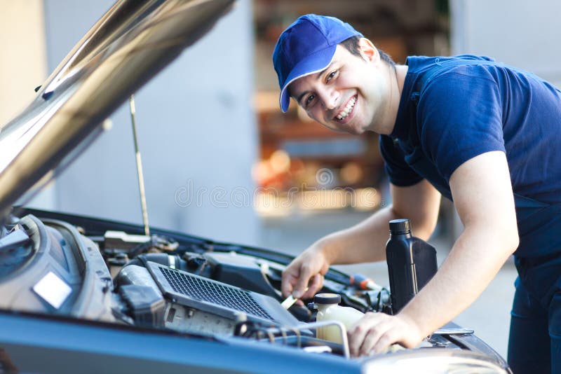 Car mechanic working in auto repair service. stock images