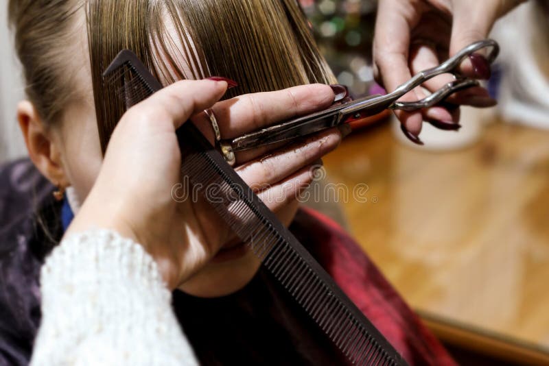 A child in a beauty salon on a haircut.  royalty free stock photos
