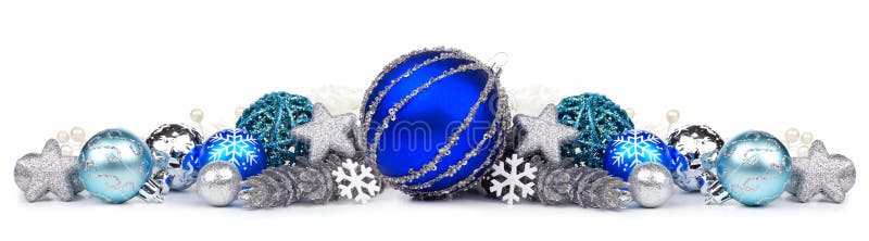 Christmas border of blue and silver ornaments over white stock images