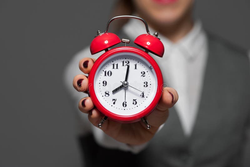 Close-up of alarm clock in a hand royalty free stock photography