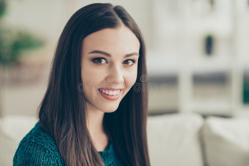 Close up photo picture of cheerful satisfied cute with straight long brown chestnut haircut looking at camera wearing. Warm green pullover stock photo