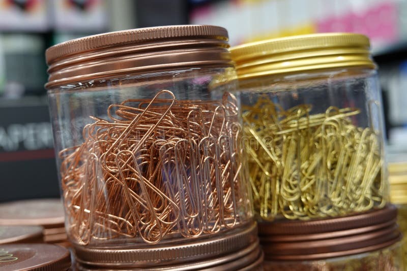 Close up Picture of gold color and copper color paperclips in the bottle. Picture of gold color and copper color paperclips in the bottle royalty free stock photo