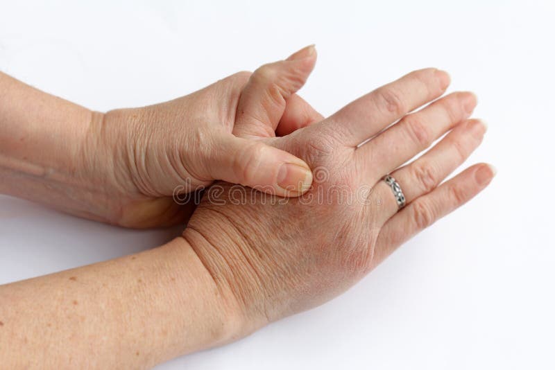 Elderly woman has pain in his hands royalty free stock photo