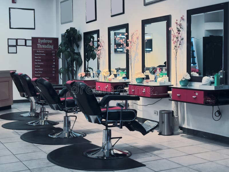 Eyebrow threading salon. Inside a shopping mall stock images