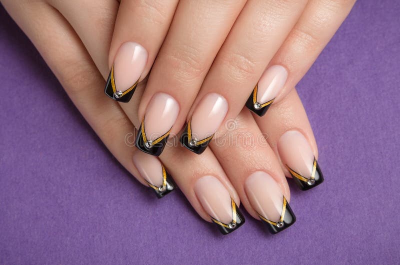 Fingernails with black french manicure stock image