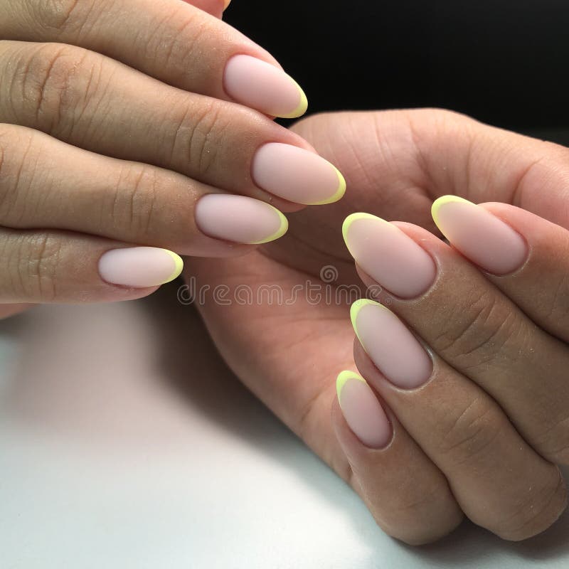 French manicure on the nails. French manicure design. Manicure gel nail polish stock image