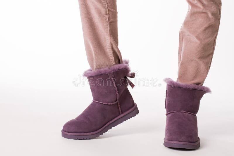 Girl in fashion winter boots. Uggs - female Australian shoes. Girl in fashion winter boots stock photo