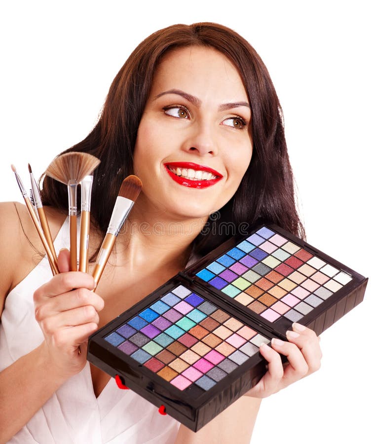 Girl holding eyeshadow and makeup brush. royalty free stock photos