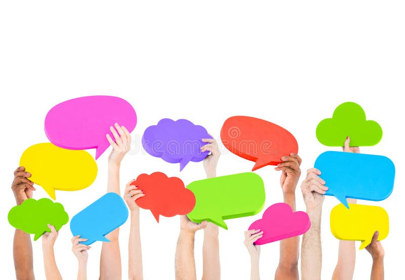 Hands holding multi colored speech bubbles Concept stock photography