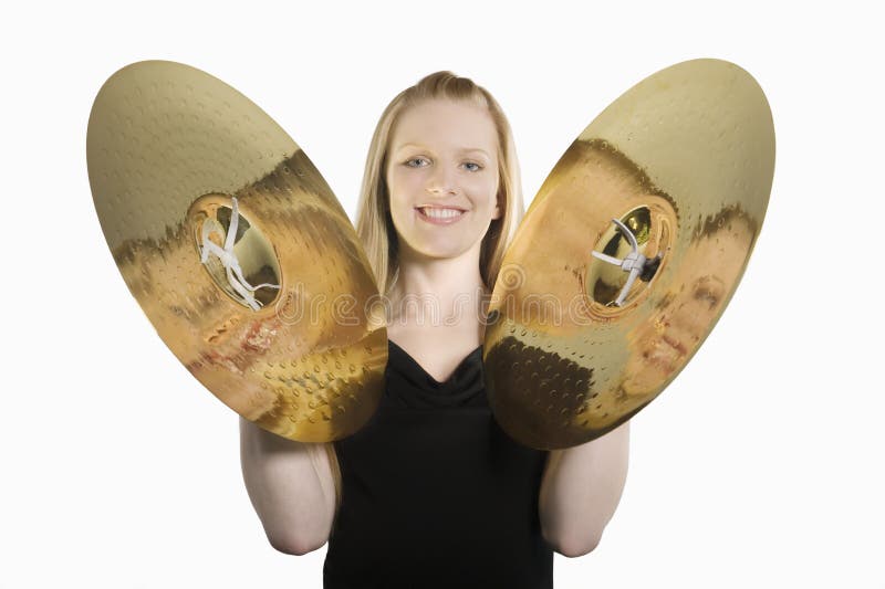 Happy Woman Banging Cymbals. Portrait of a happy woman banging cymbals isolated over white background royalty free stock photo