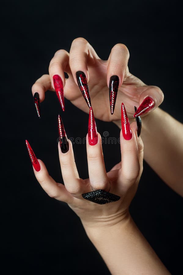 Holiday halloween or new year nail art design ideas. Beauty Fashion Hands Trendy Stylish Colorful manicure. Black Red with stock photo