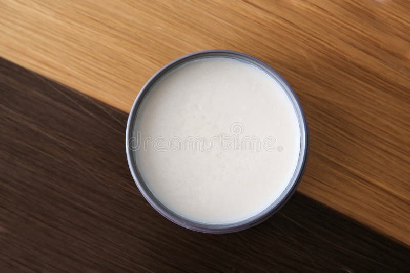 Jar with clay for styling on strands of blonde. And brown hair royalty free stock photo