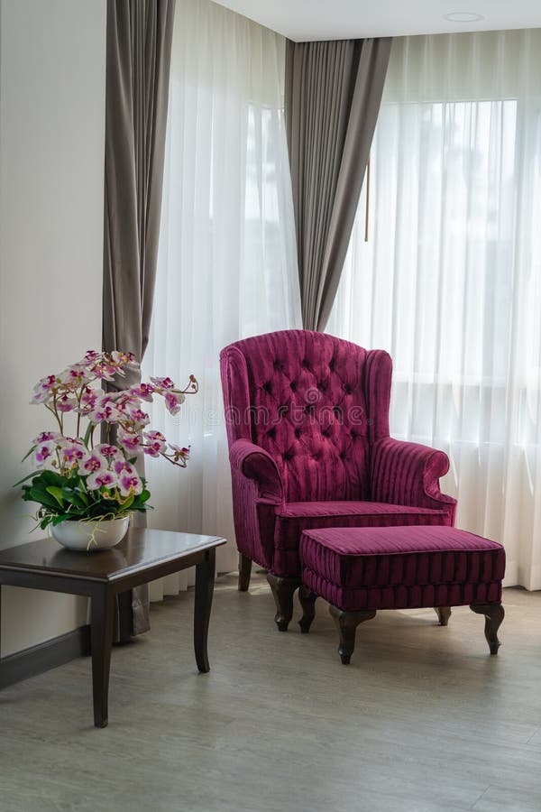 Luxury antique classic wooden armchair with burgundy velvet interior decoration royalty free stock photography