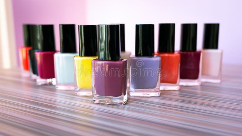 Many colored bottles of nail polish stock photos