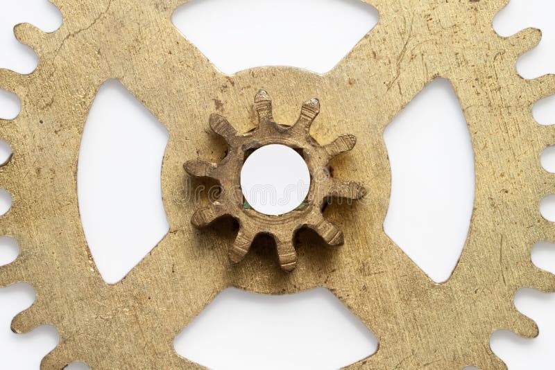 Metal golden color copper gear wheel isolated with white background.  stock image
