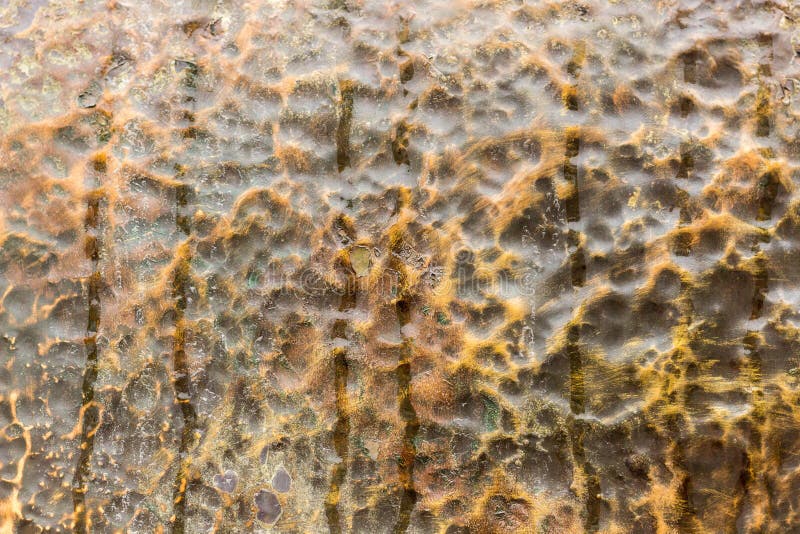 Metal uneven surface color of copper. Abstract grunge metallic bronze copper textured wall background. Creative modern design.  stock photography