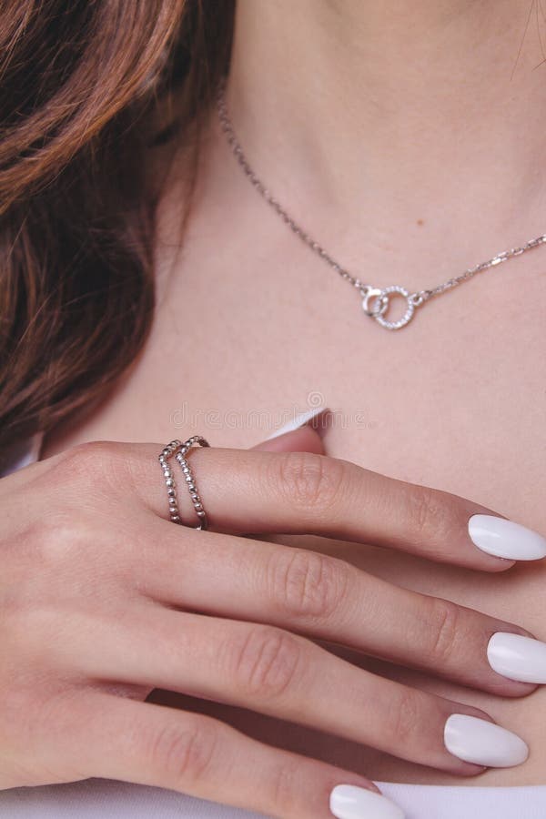 Model with silver chain and silver ring stock photography