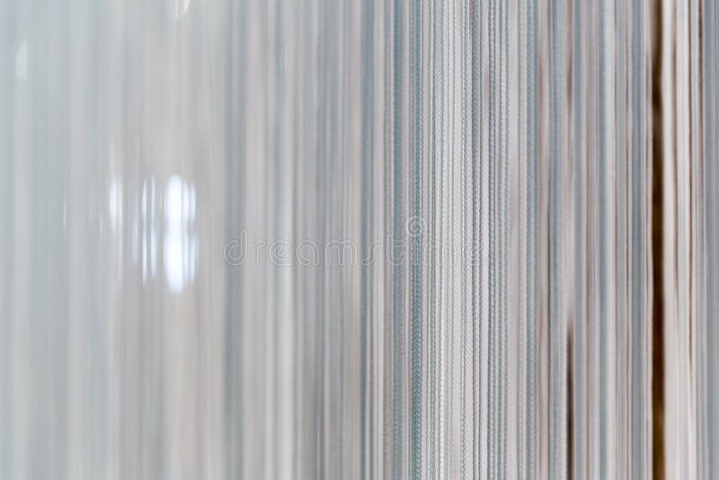 Modern white curtain. With many strands royalty free stock image