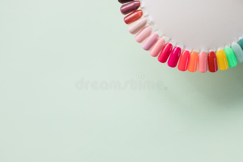 Nails art design samples on soft pastel background. Manicure nail polish colors palette. Nails polish testers in royalty free stock photography