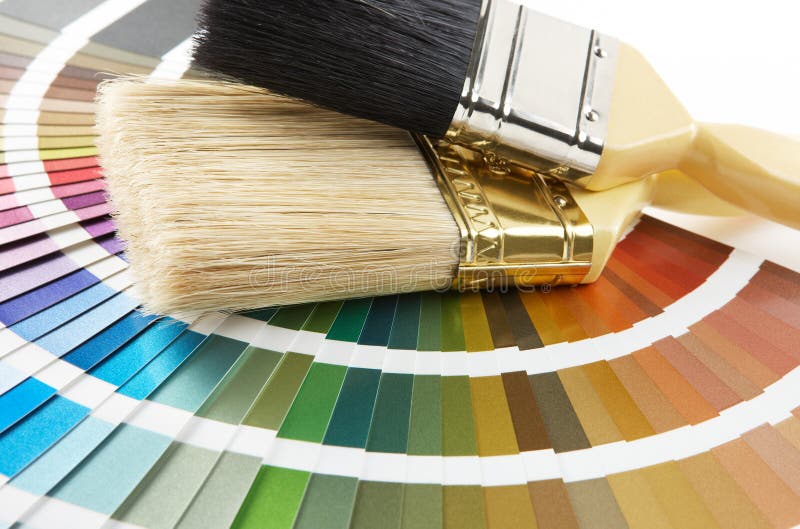 Paint brush on color chart stock photography