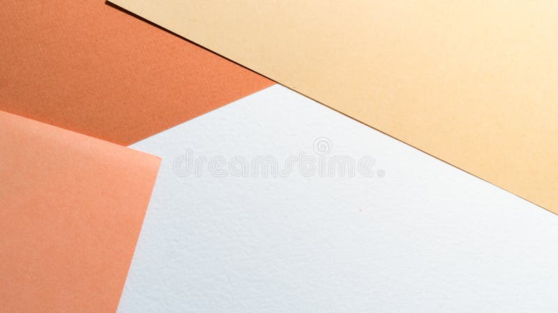 Paper background. Color papers geometry shape composition background with white beige copper and brown color tones. Minimalism geome