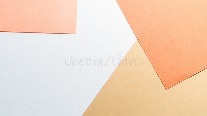 Paper background. Color papers geometry shape composition background with white beige copper and brown color tones. Minimalism geometric flat lay backdrop. Top royalty free stock photography