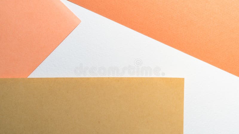 Paper background. Color papers geometry shape composition background with white beige copper and brown color tones. Minimalism geometric flat lay backdrop. Top royalty free stock images