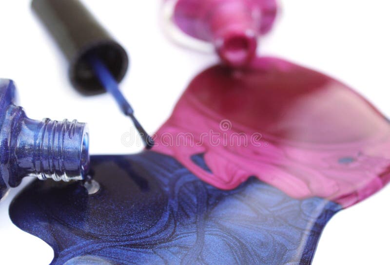 Pink and Blue Spilled Nail Polish stock photo