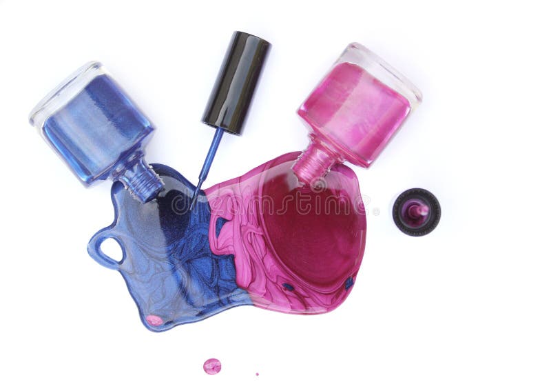 Pink and Blue Spilled Nail Polish on White royalty free stock photography