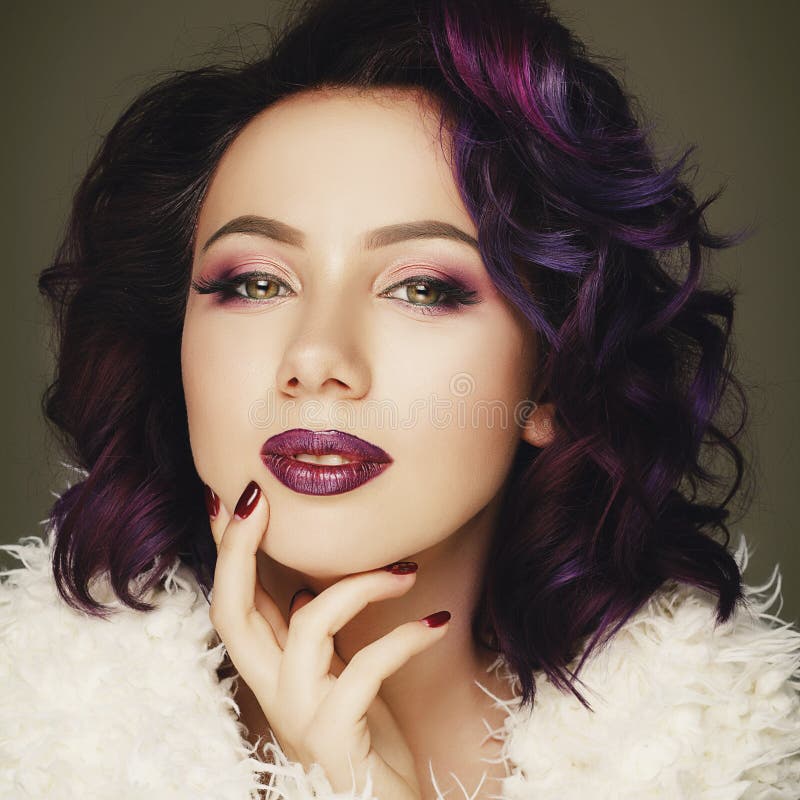 Portrait of beautiful fashion model with purple hair over g royalty free stock photo
