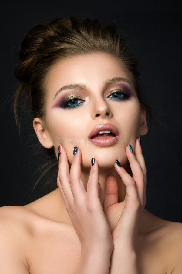 Portrait of young beautiful woman with blue eyes stock image