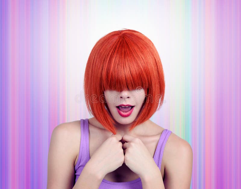 Portrait young woman with red hair and bang covering her eyes.  royalty free stock photography