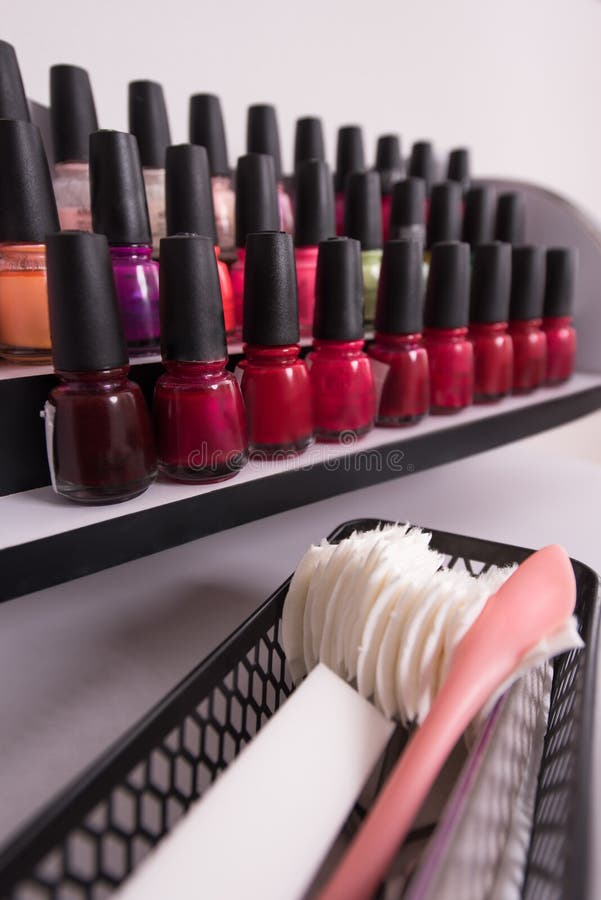 Set of different bottles of nail polish stock images