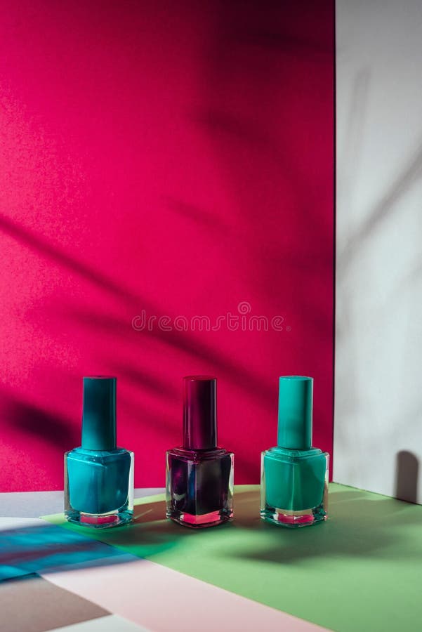 Set of different nail polish, on colorful background royalty free stock image