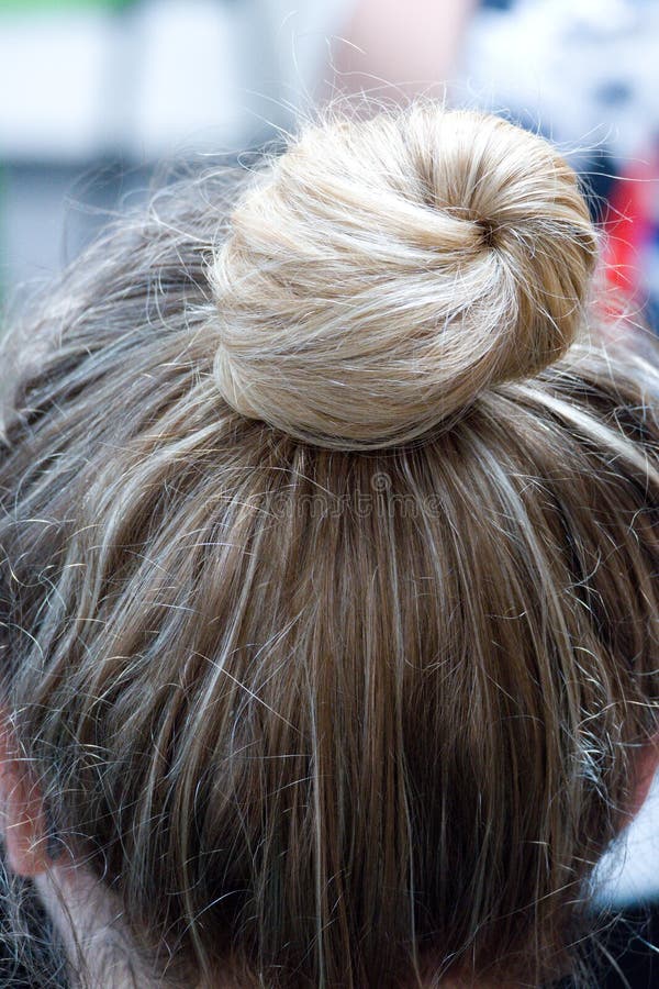 Simple hairstyle for a blonde woman stock image