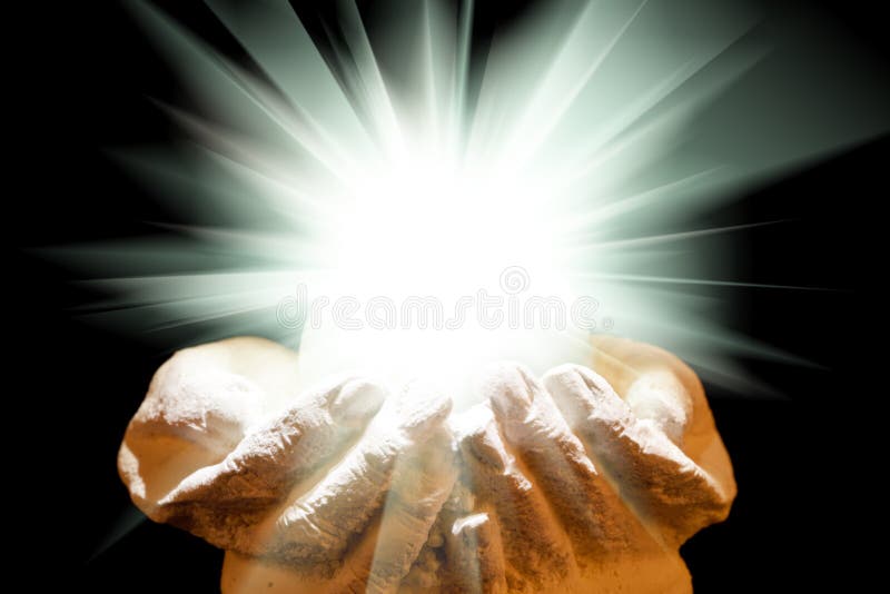 Spiritual light in cupped hands stock photo