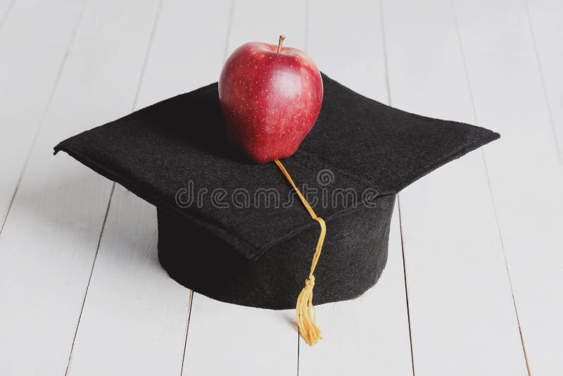 Square academic hat. With apple stock images