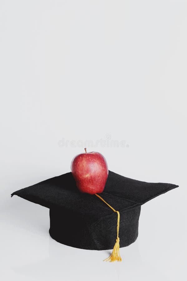 Square academic hat. With apple stock image