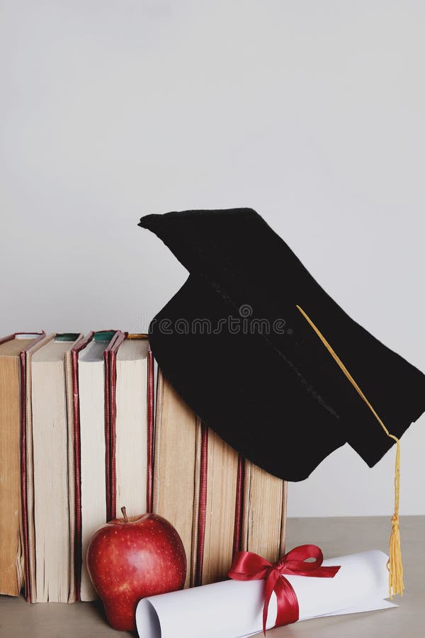 Square academic hat. Graduation. Square academic hat with books royalty free stock photography