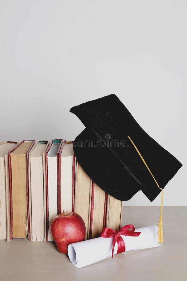 Square academic hat. Graduation. Square academic hat with books royalty free stock image
