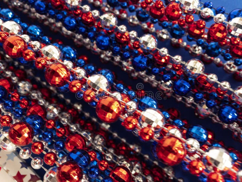 Strands of red,white & blue beads,stars, great background for July 4th,Memorial Day. Patriots Day,Remembrance Day,patriotic backgrounds.Vertical and diagonal royalty free stock images