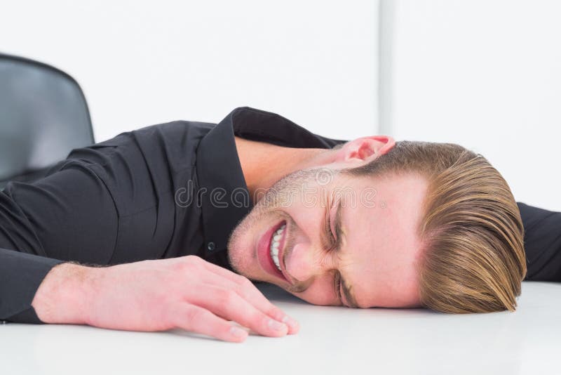 Stressed businessman banging his head. On white background stock photos