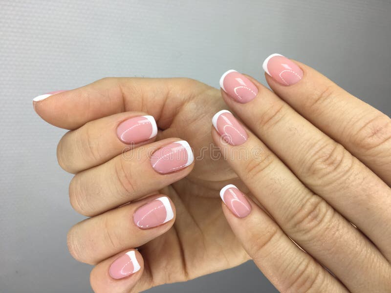trendy french manicure with bright white stock photos