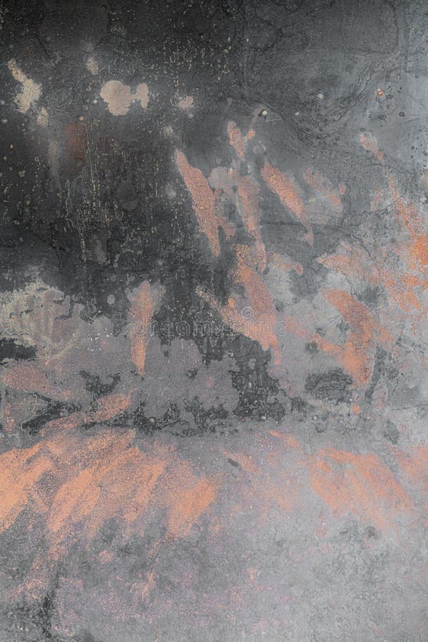 Weathered metal in black color with abstract oxidized effect in copper color.  stock photo